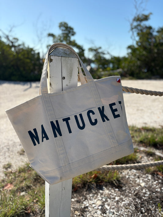 LBS Designs hand painted Nantucket signature status heritage canvas tote featuring buoys from harbor dockside
