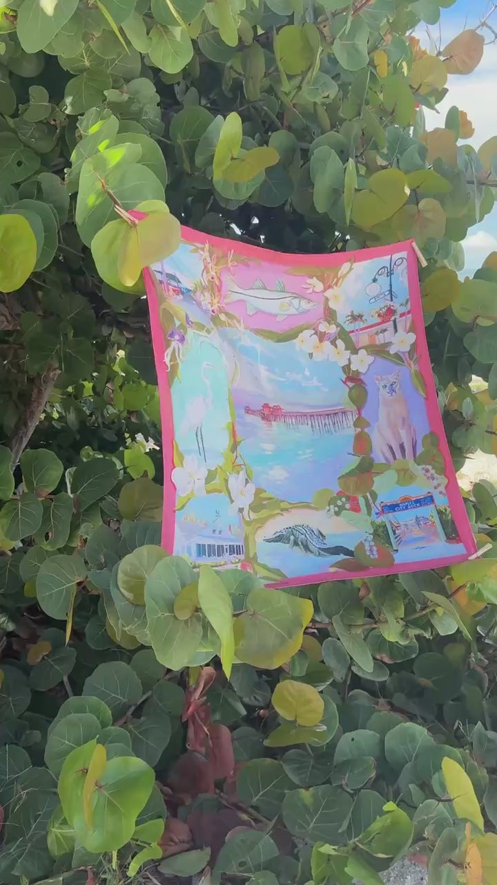 Conch Pink Naples scarf blowing in the sea grapes